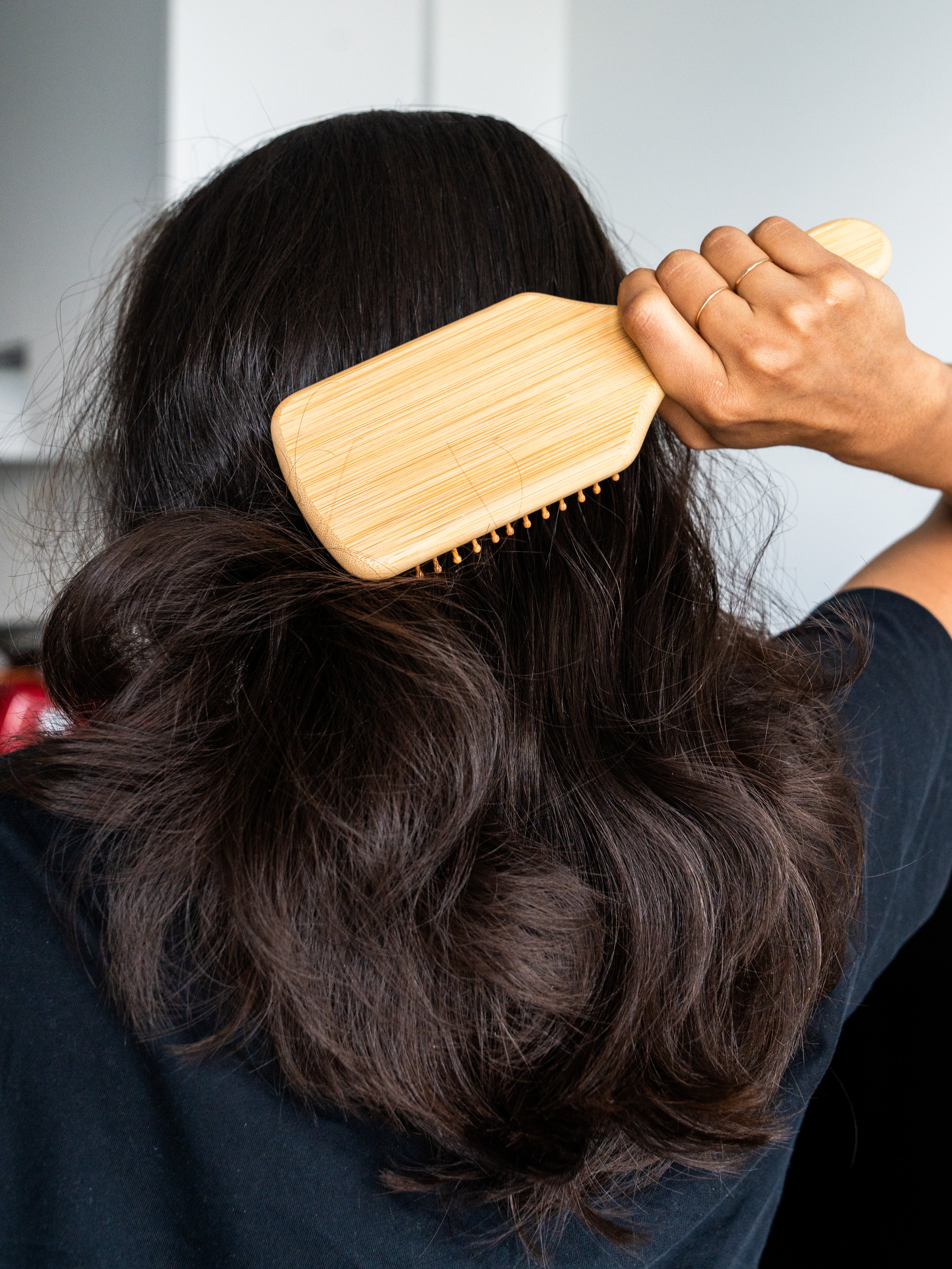 Head of hair with bamboo brush
